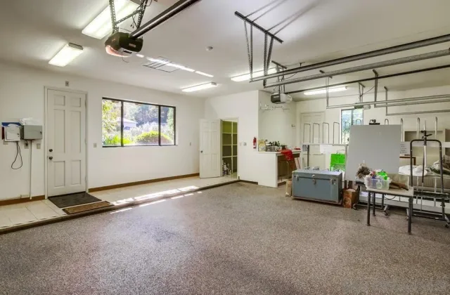 an aerial view of a house with yard and outdoor seating