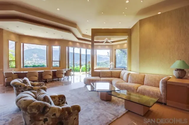 a living room with furniture or couch and a large window