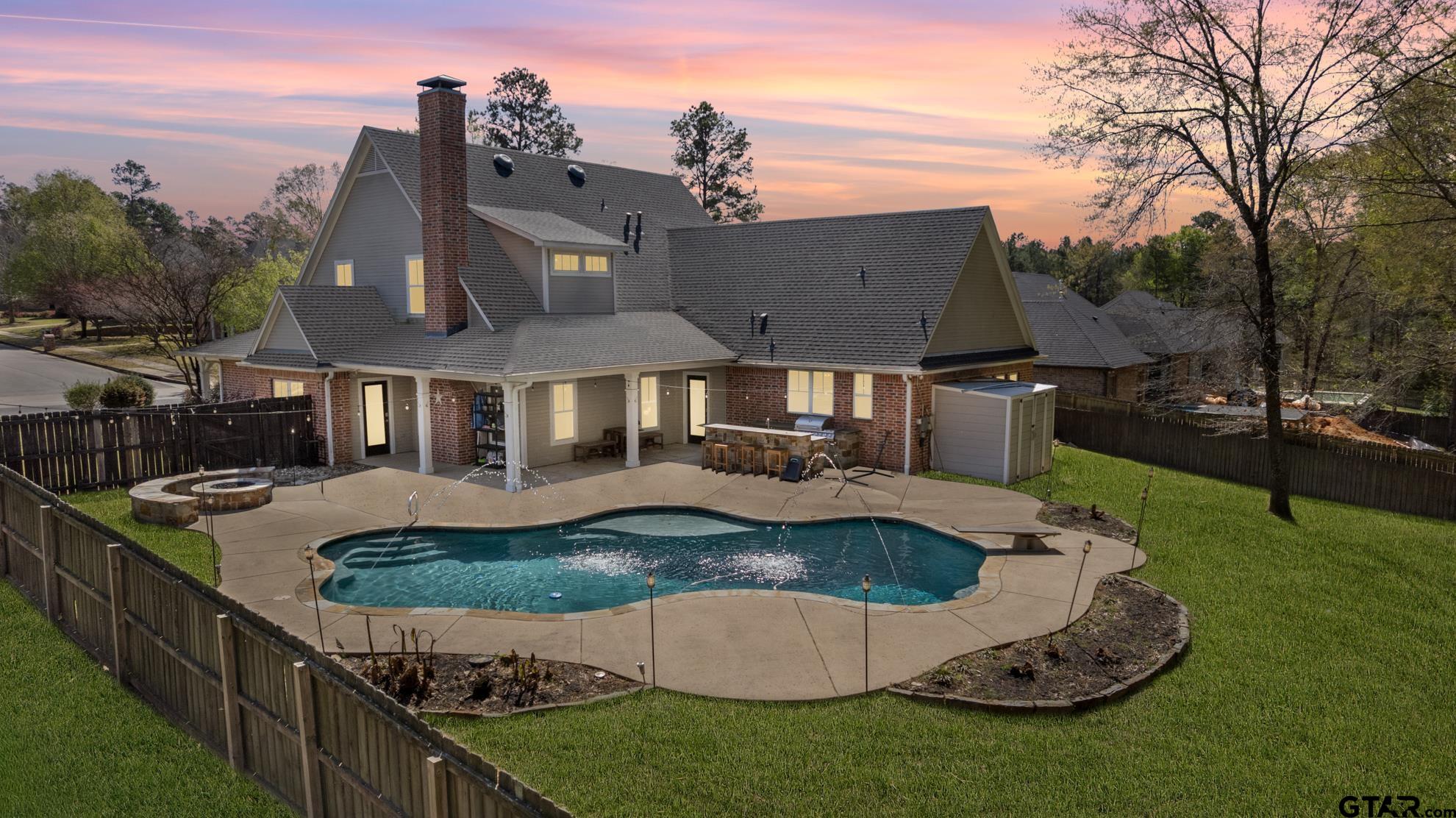 9453 Cherokee Trail Tyler, TX 75703 - Photo 3 of 40 a front view of a house with swimming pool