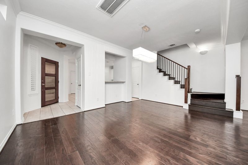 4222 Drake Street Houston, TX 77005 - Photo 6 of 28 wooden floor in an empty room with a window
