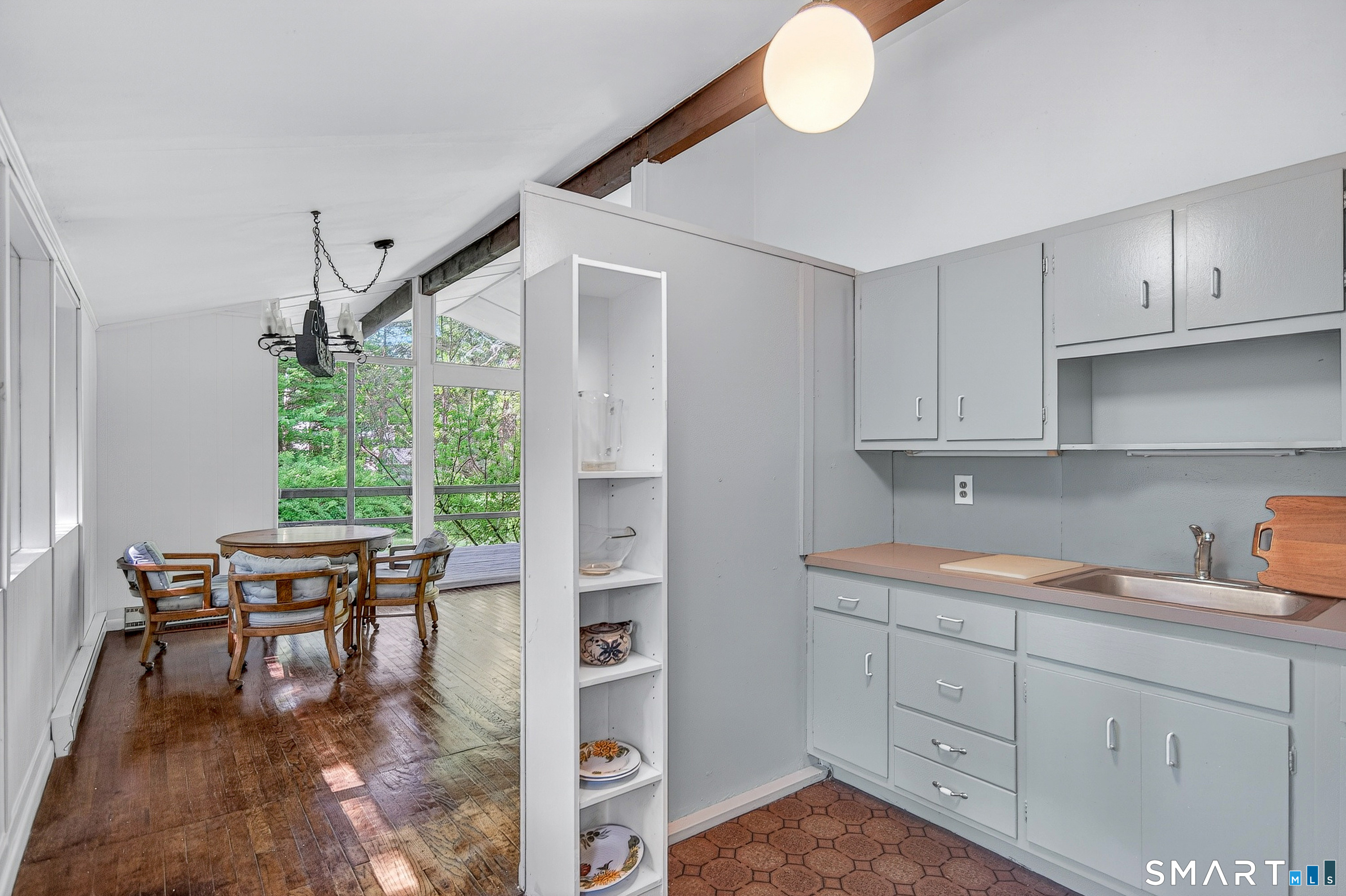 4 Pepper Pond Road Sherman, CT 06784 - Photo 12 of 33 a kitchen with stainless steel appliances granite countertop a stove a sink dishwasher and white cabinets with wooden floor