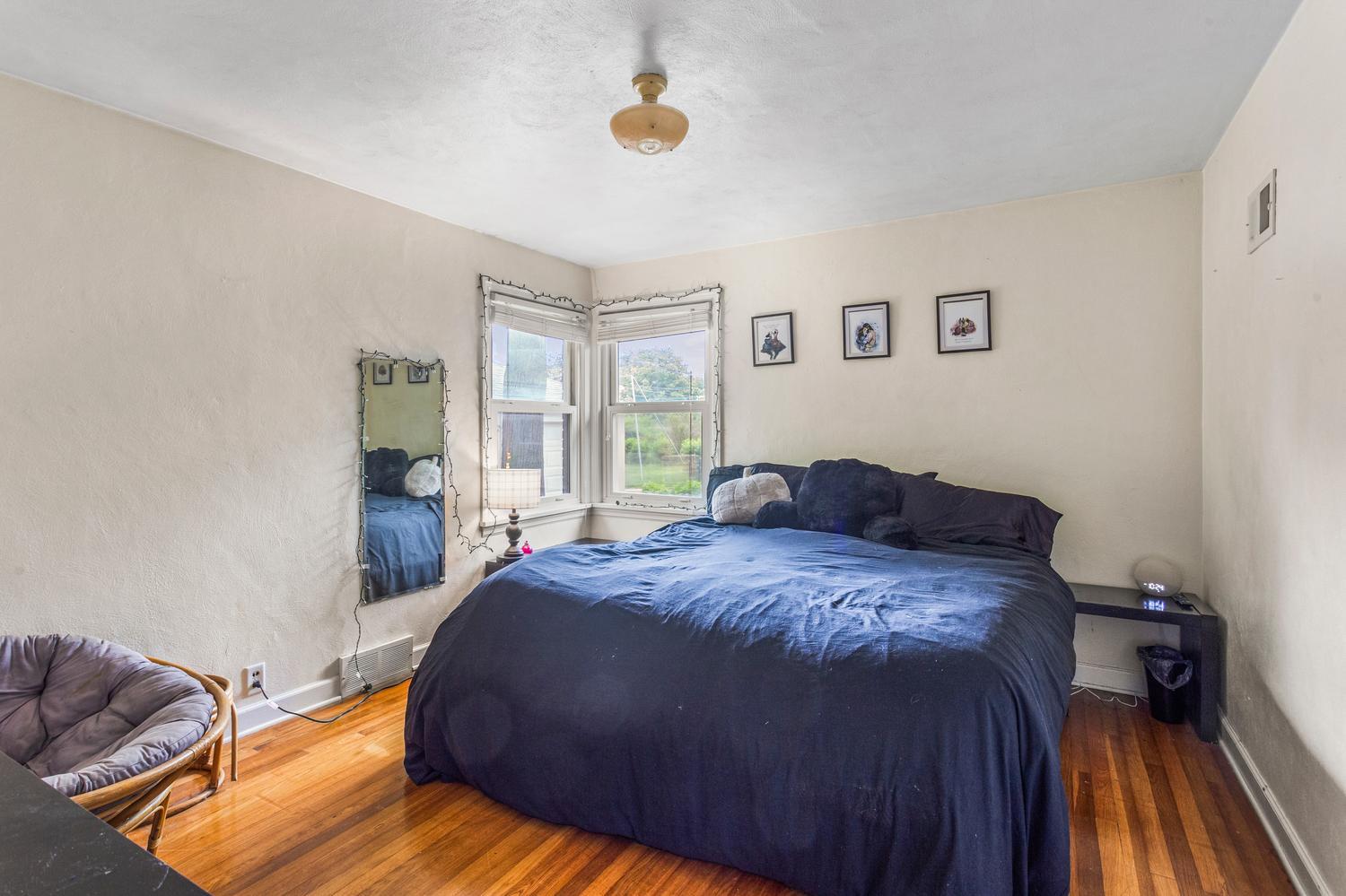 1117 West Union Street Champaign, IL 61821 - Photo 20 of 29 a bed sitting in a bedroom next to a window