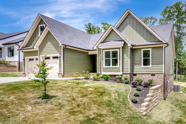 a front view of a house with garden