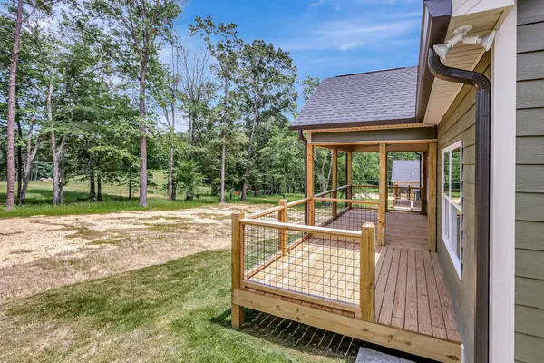 a view of balcony with wooden floor and outdoor space