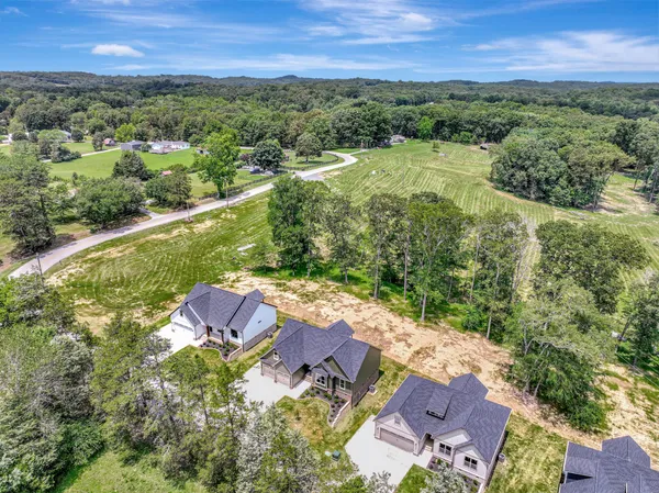 an aerial view of a house with a garden