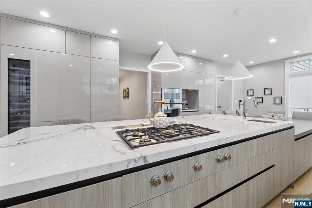 31 Engleside Street Cresskill, NJ 07626 - Photo 14 of 49 a kitchen with stainless steel appliances kitchen island granite countertop a stove a sink and a refrigerator
