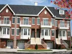 a front view of residential houses with street