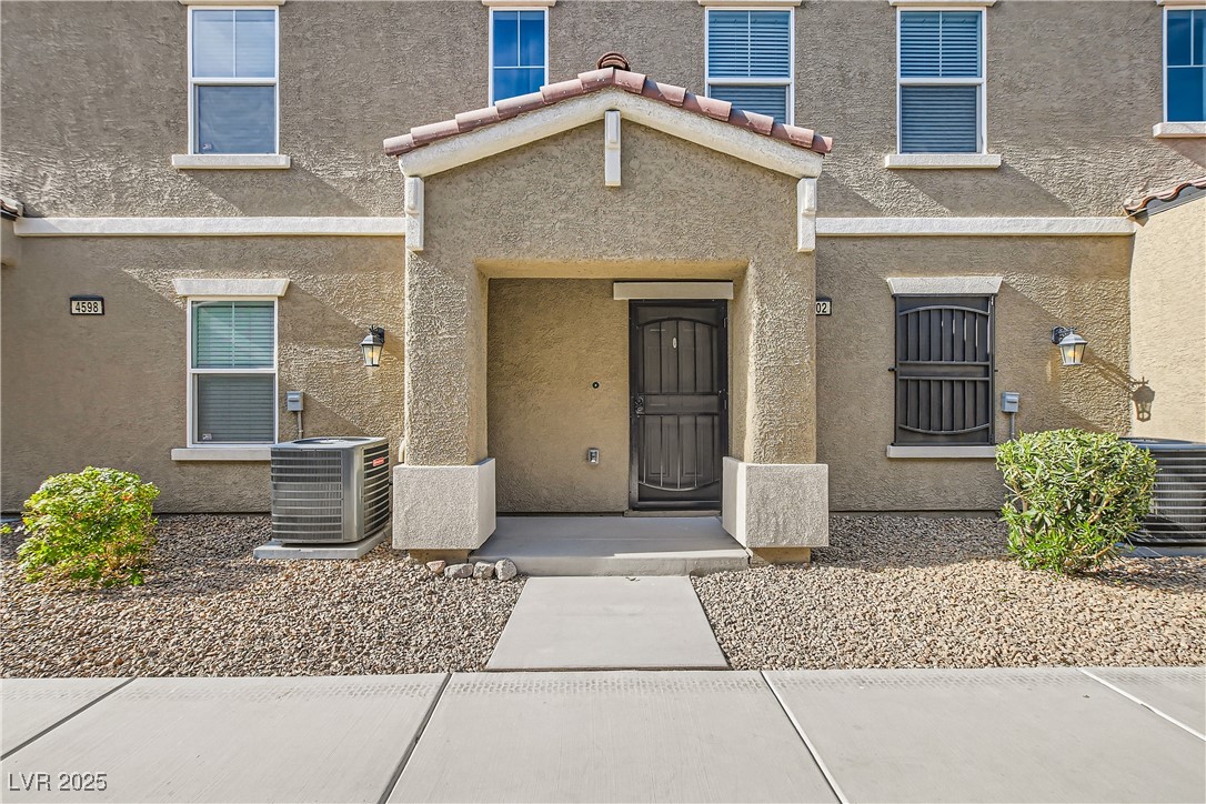 4602 Ingleton Circle Las Vegas, NV 89115 - Photo 10 of 11 Entrance to property with stucco siding and coolin