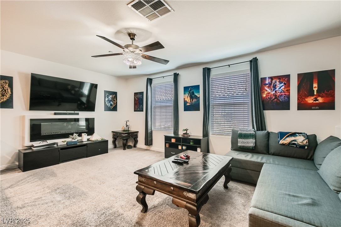 4602 Ingleton Circle Las Vegas, NV 89115 - Photo 3 of 11 Living area with ceiling fan, carpet floors, visib