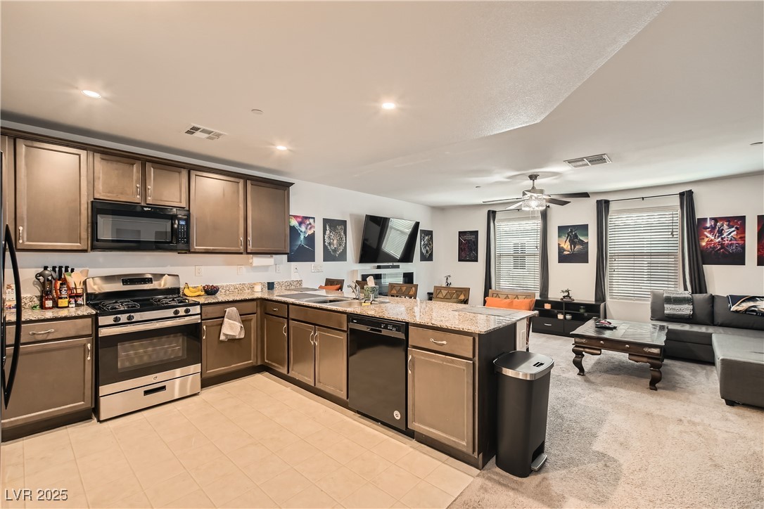 4602 Ingleton Circle Las Vegas, NV 89115 - Photo 11 of 11 Kitchen featuring a peninsula, open floor plan, vi