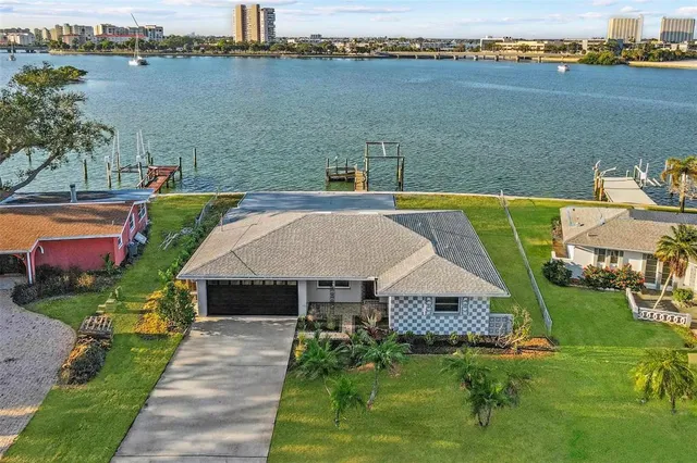an aerial view of a house with swimming pool and outdoor space