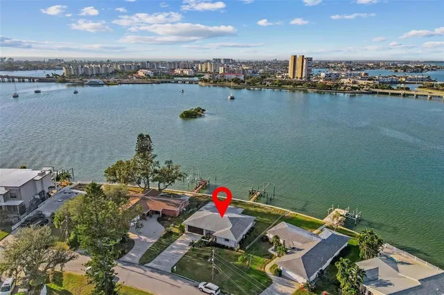 an aerial view of a house with floor to dining space wooden floor and lake view