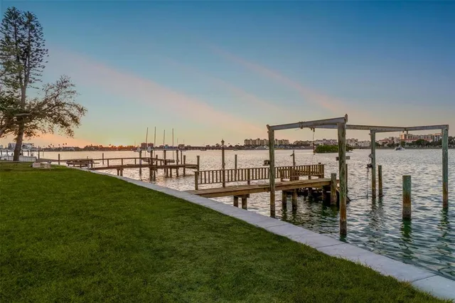 a view of a swimming pool with an outdoor seating and mountain view