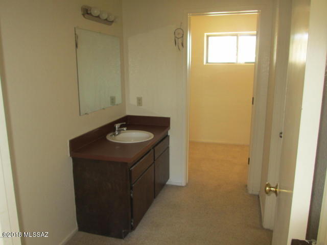 1160 Avenida Leon Rio Rico, AZ 85648 - Photo 24 of 47 a bathroom with a sink and a mirror