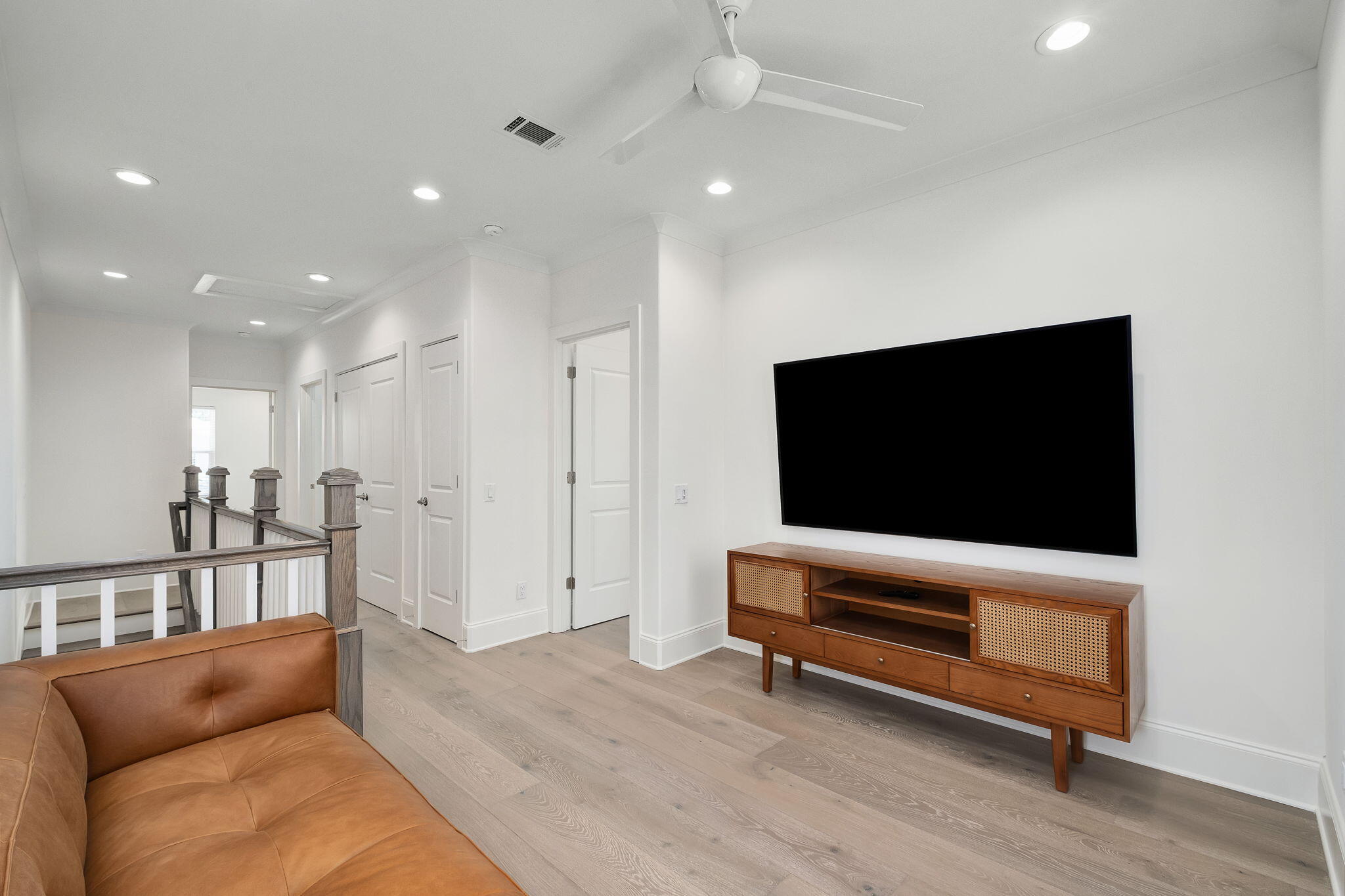 74 Heron's Crossing Santa Rosa Beach, FL 32459 - Photo 17 of 41 a living room with furniture and a flat screen tv