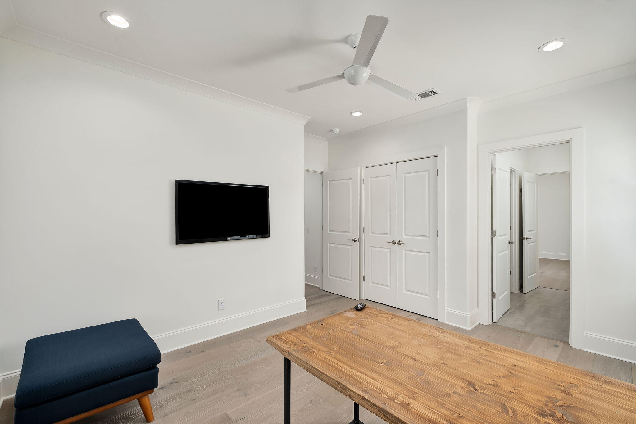 74 Heron's Crossing Santa Rosa Beach, FL 32459 - Photo 19 of 41 a living room with a flat screen tv on dresser and a table