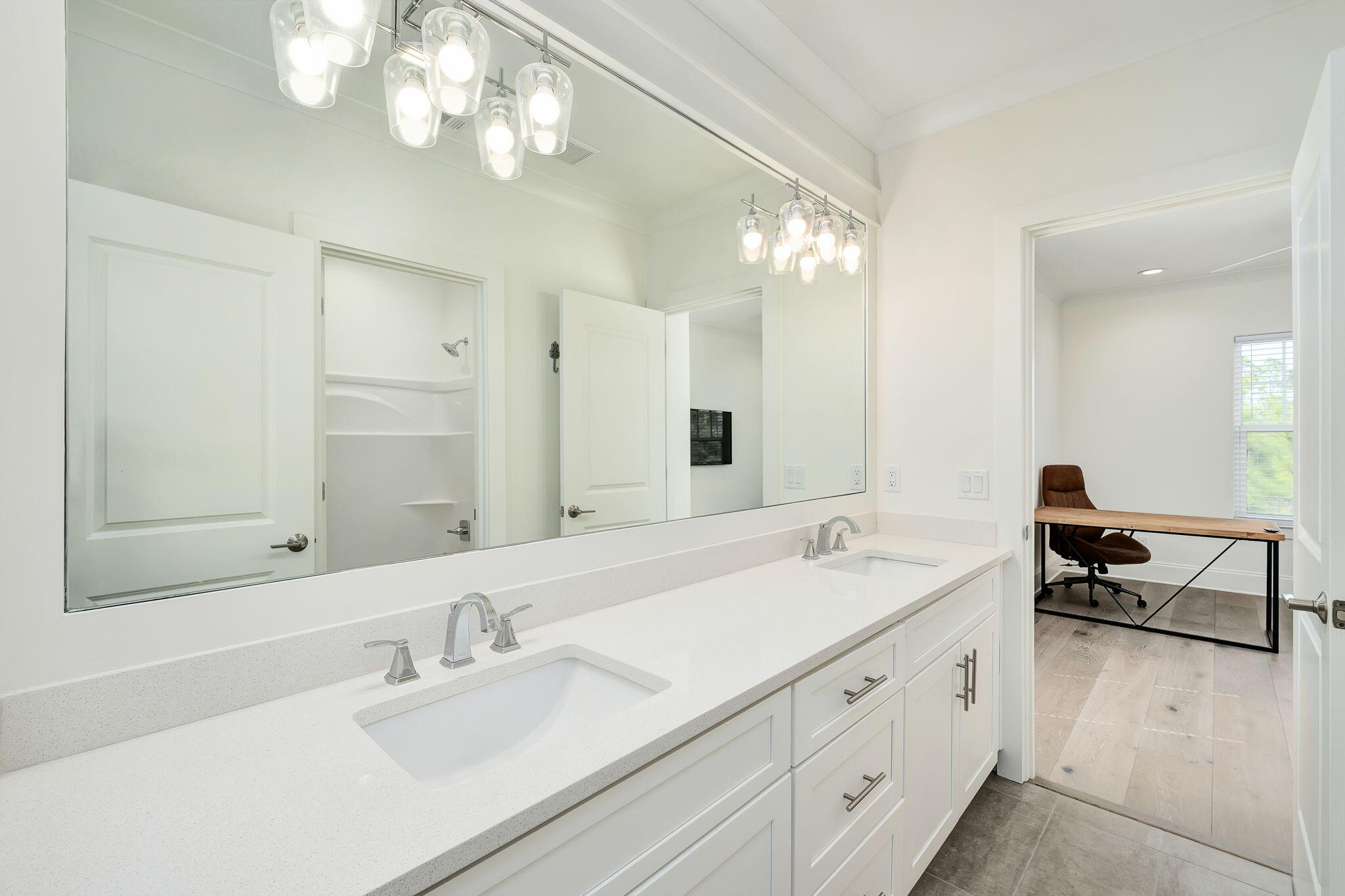 74 Heron's Crossing Santa Rosa Beach, FL 32459 - Photo 21 of 41 a spacious bathroom with double vanity a sink a large mirror and a shower
