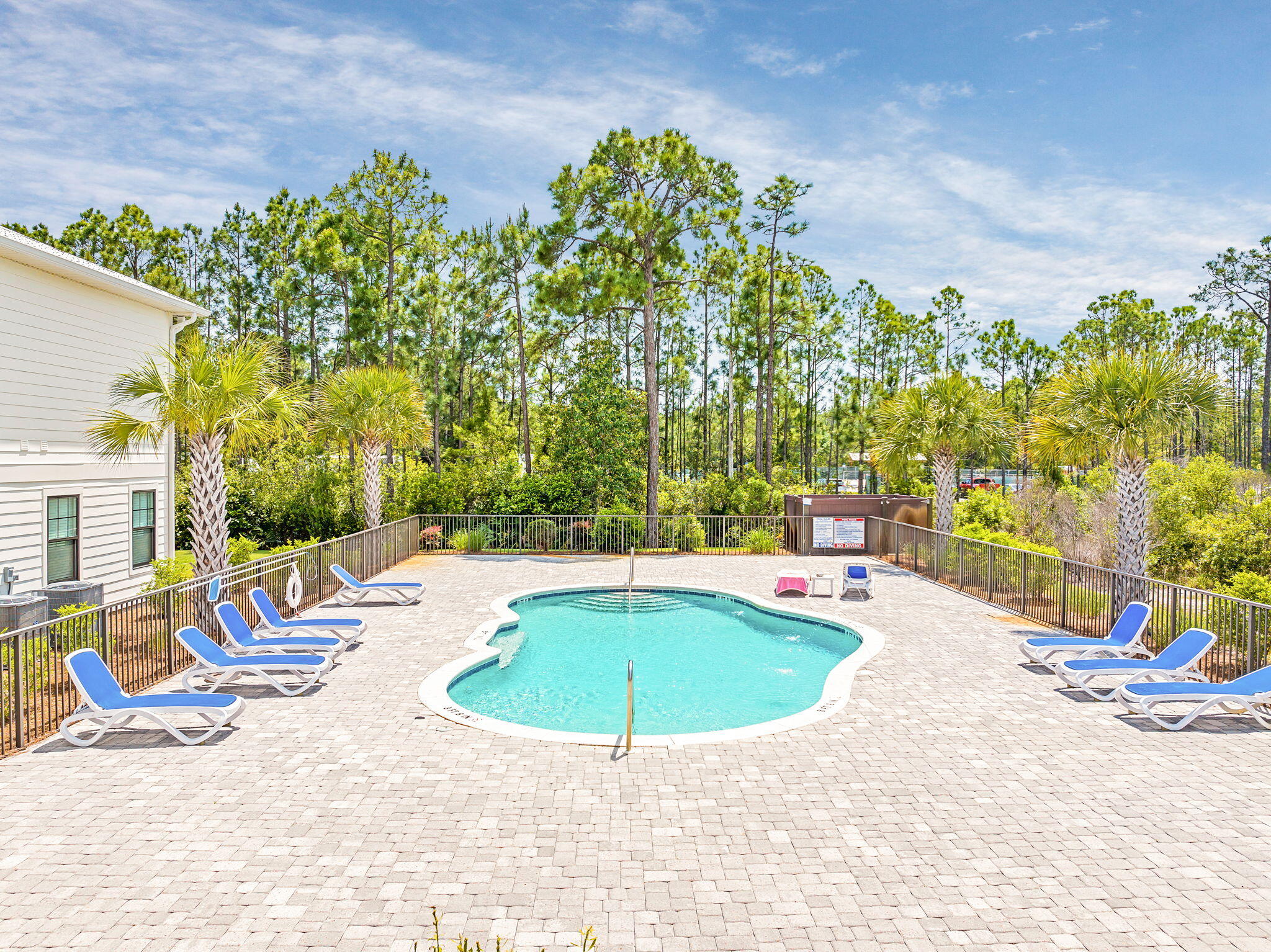 74 Heron's Crossing Santa Rosa Beach, FL 32459 - Photo 27 of 41 a view of a swimming pool with a lounge chairs