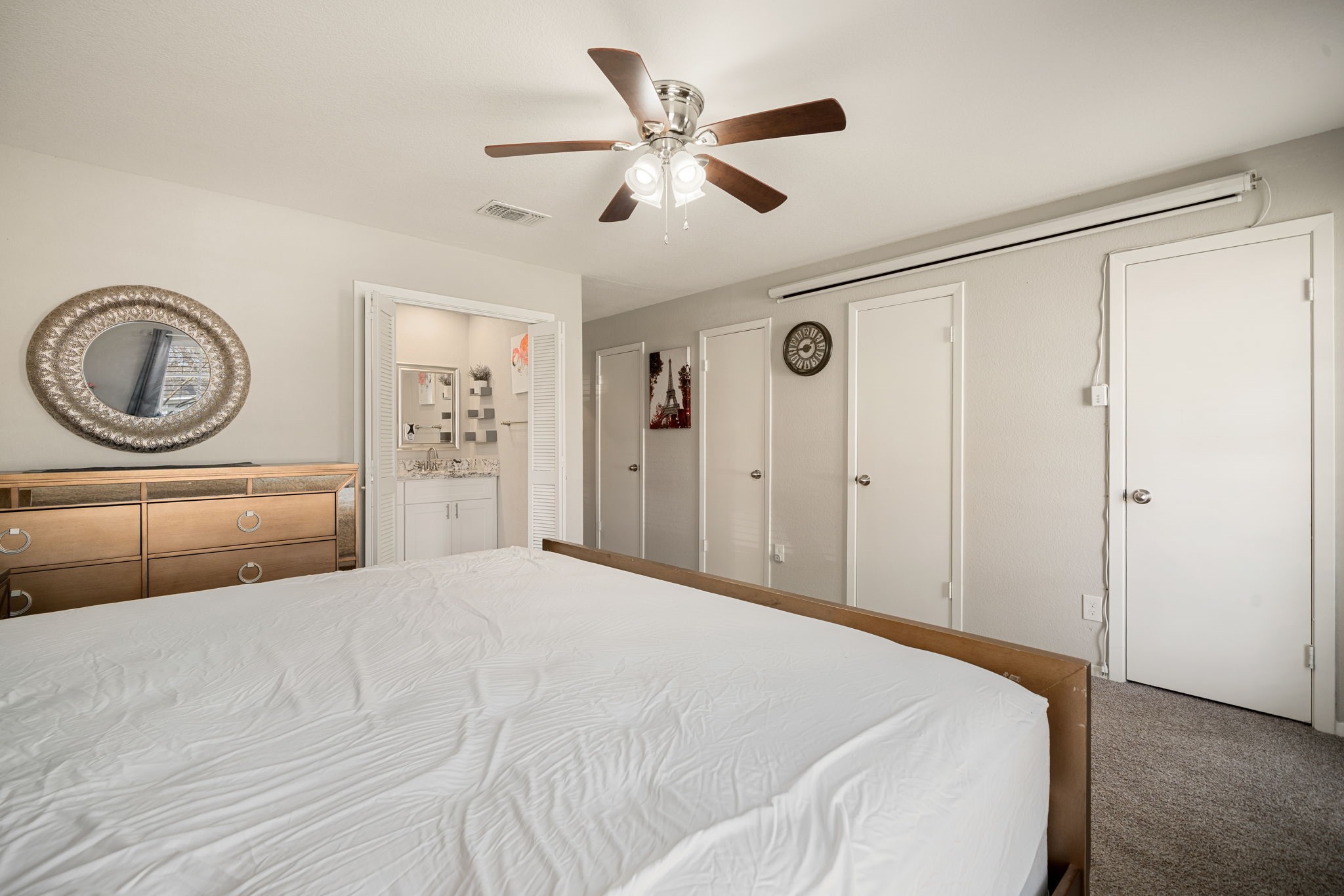 9019 Grape Street Houston, TX 77036 - Photo 14 of 24 a bedroom with a large bed and a large window