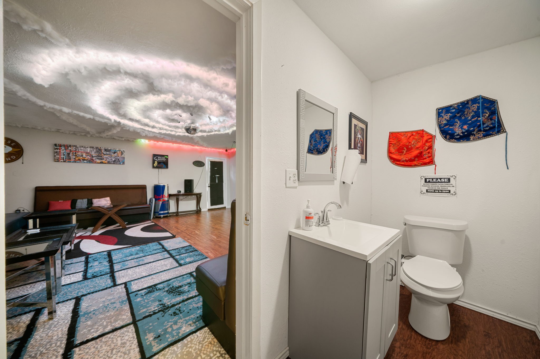 9019 Grape Street Houston, TX 77036 - Photo 20 of 24 a bathroom with a toilet sink and mirror