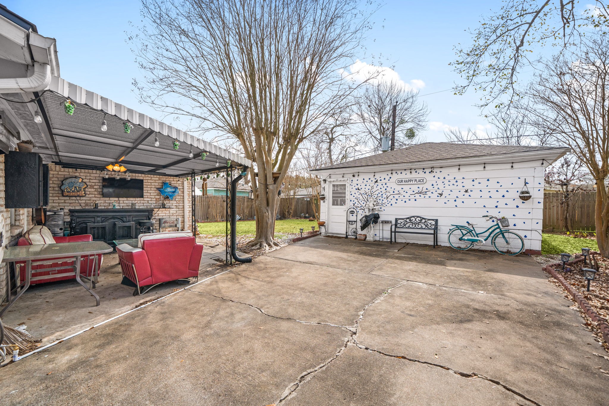 9019 Grape Street Houston, TX 77036 - Photo 21 of 24 a view of backyard with outdoor seating and trees