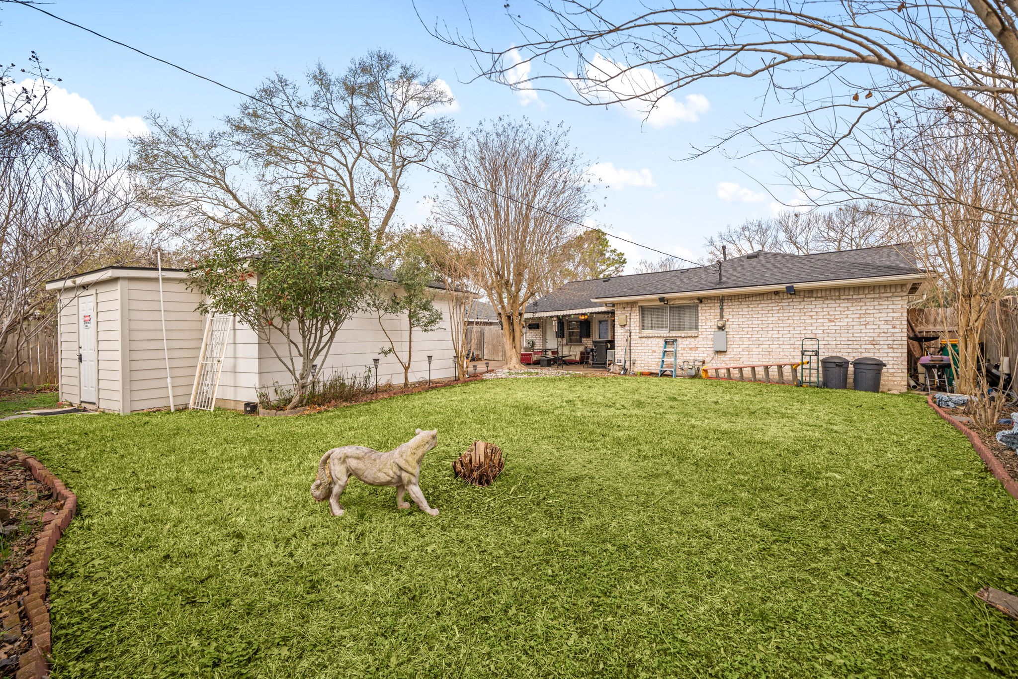 9019 Grape Street Houston, TX 77036 - Photo 24 of 24 a view of a house with a yard