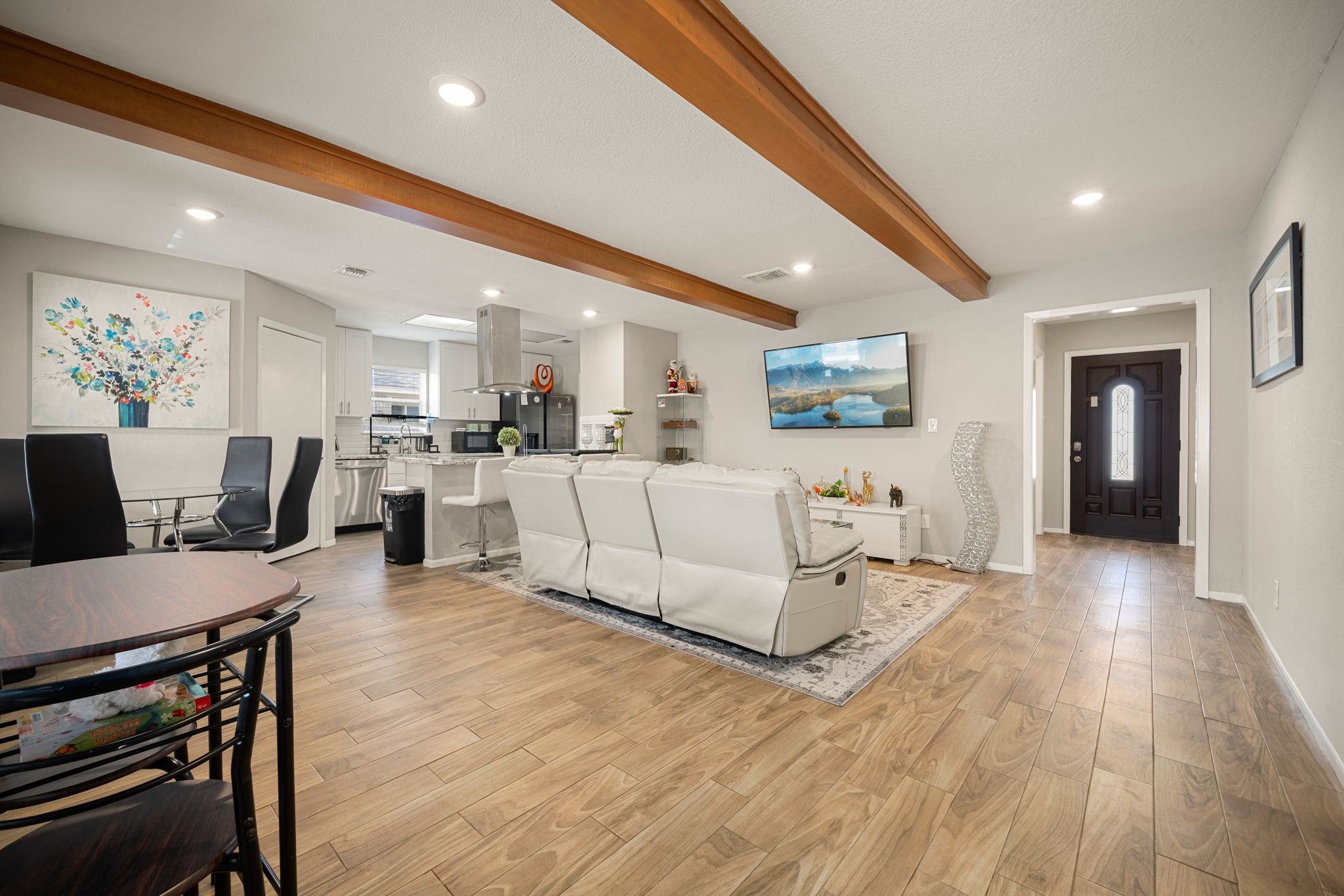 9019 Grape Street Houston, TX 77036 - Photo 5 of 24 a living room with furniture and a table