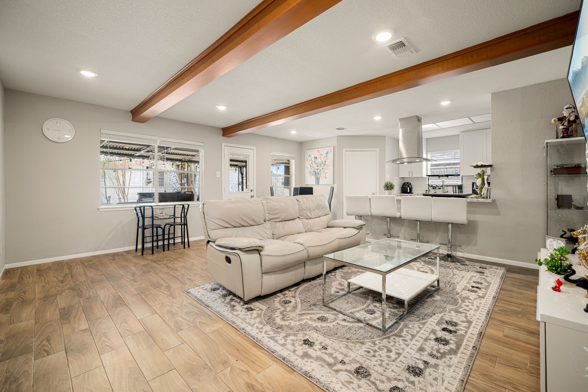 9019 Grape Street Houston, TX 77036 - Photo 6 of 24 a living room with furniture and wooden floor