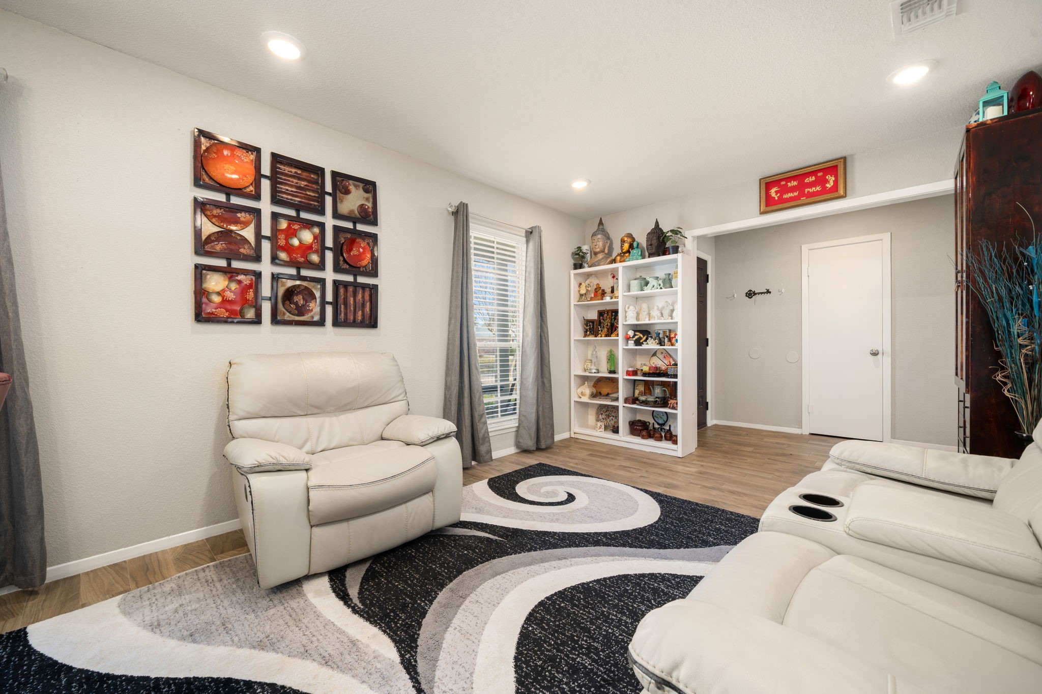 9019 Grape Street Houston, TX 77036 - Photo 7 of 24 a living room with furniture and a couch