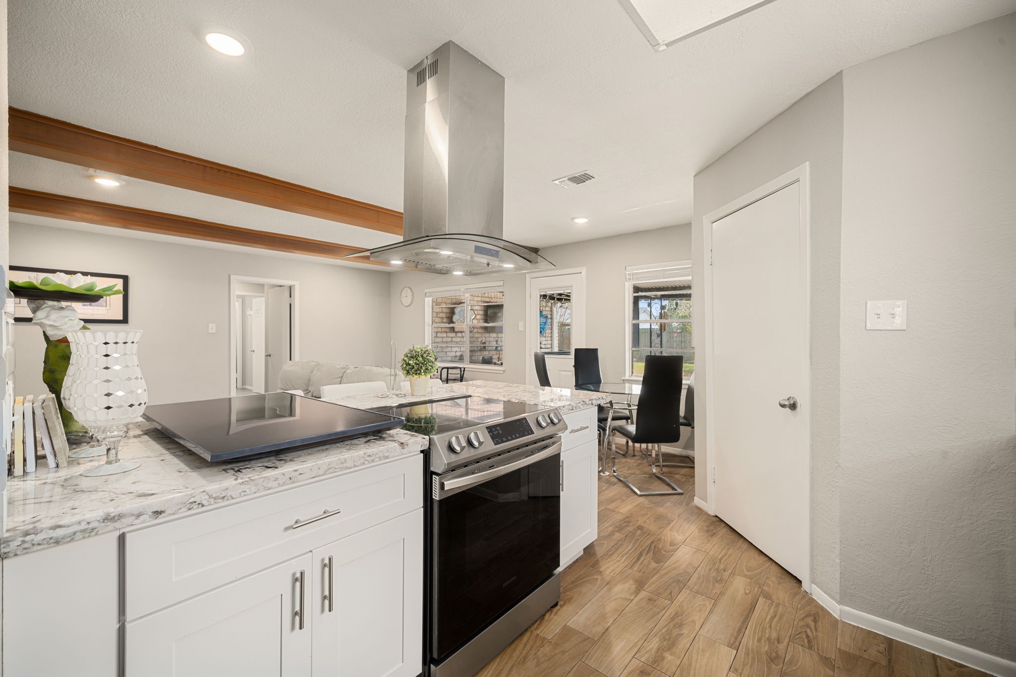 9019 Grape Street Houston, TX 77036 - Photo 9 of 24 a kitchen with granite countertop a sink stainless steel appliances and cabinets