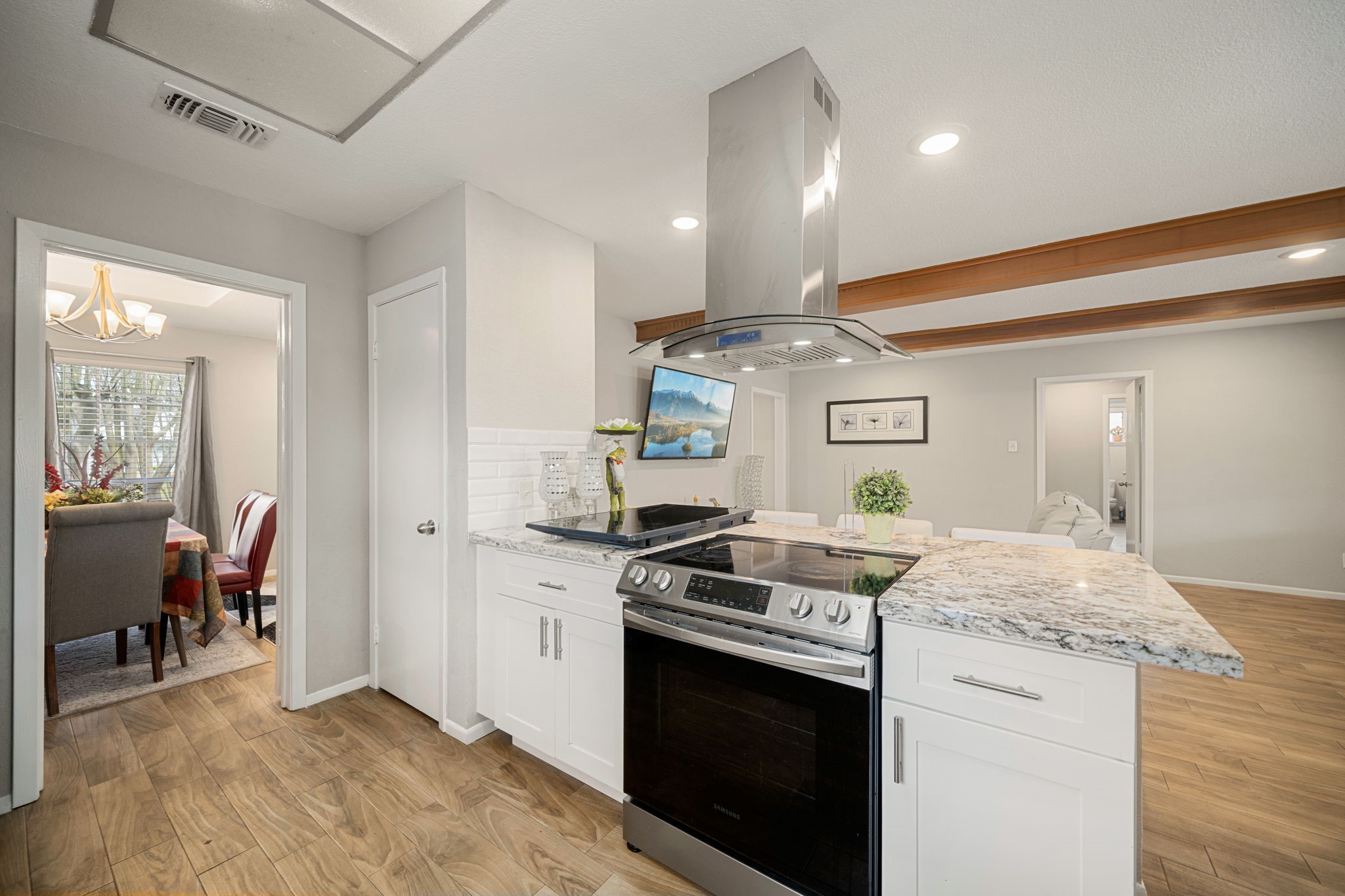 9019 Grape Street Houston, TX 77036 - Photo 10 of 24 a kitchen with stainless steel appliances granite countertop a stove and a sink