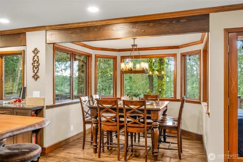 a view of a dining room with furniture window and outside view