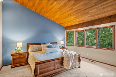 a bedroom with furniture and windows