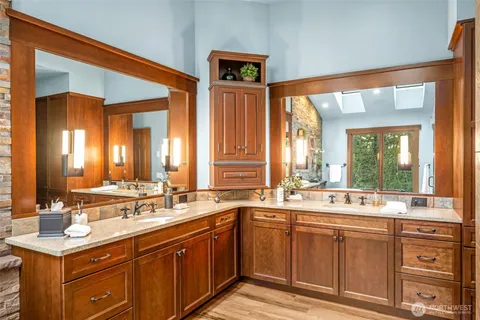 a bathroom with a sink and a large mirror