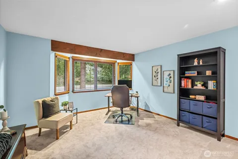 a workspace with furniture hardwood and a window