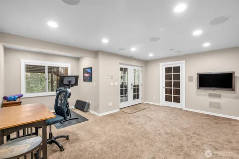 a view of a livingroom with furniture and a flat screen tv