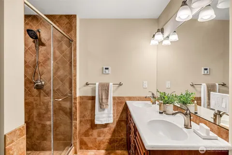 a dining room with furniture and a chandelier