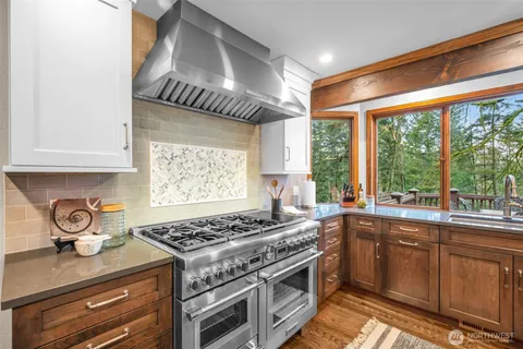 a kitchen with a stove and a sink