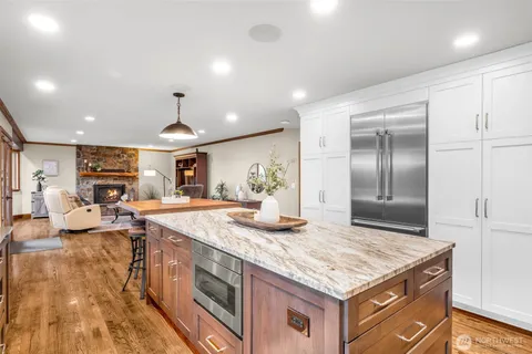 a kitchen with stainless steel appliances granite countertop a stove and a refrigerator