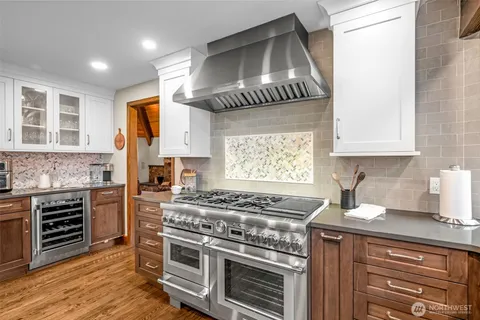 a kitchen with a stove and a sink