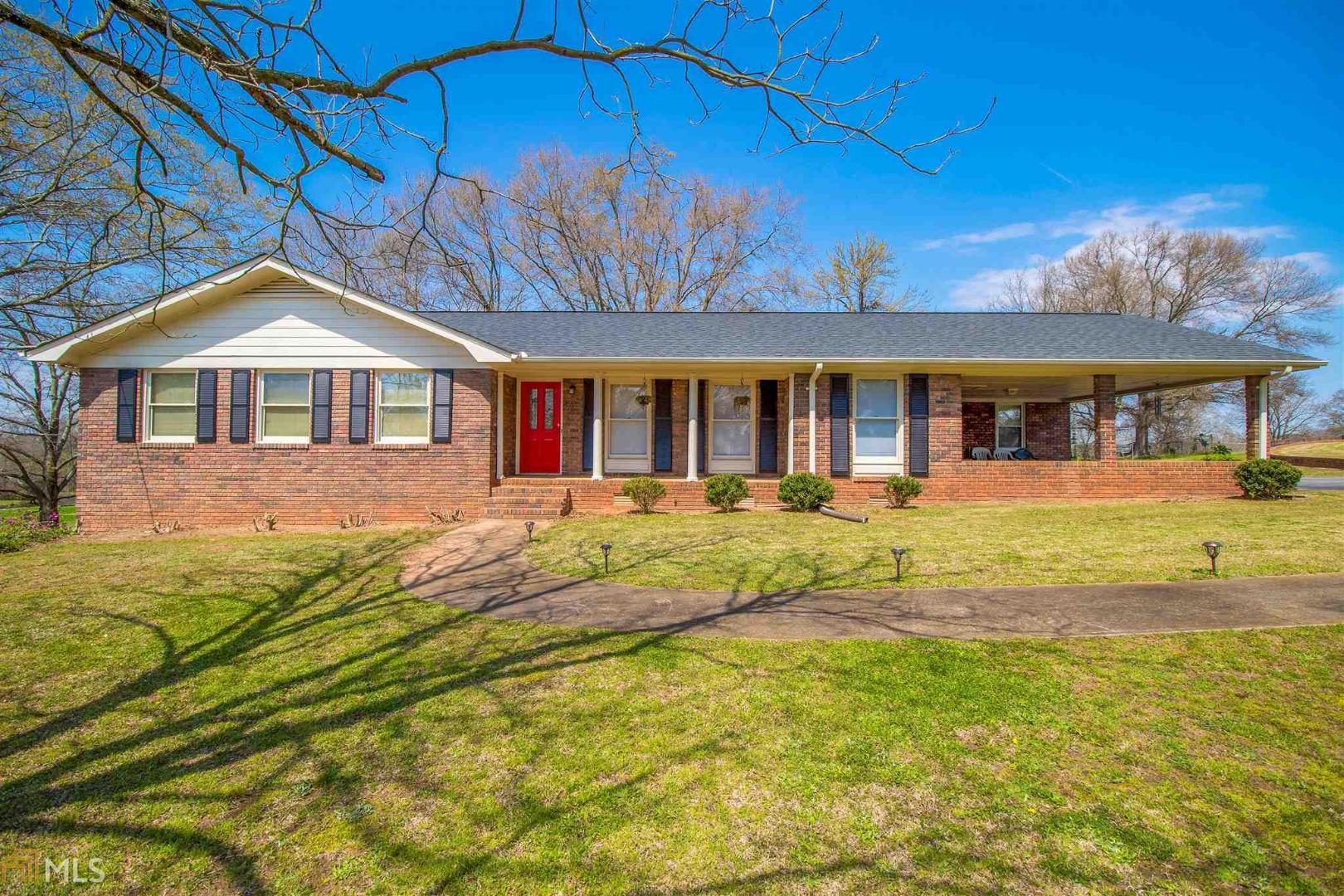 966 Loyd Nelms Road Nicholson, GA 30565 - Photo 1 of 1 a front view of a house with a yard