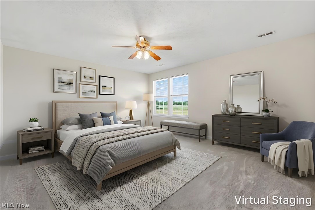 3280 Seven Bridges Road Medina, OH 44256 - Photo 28 of 41 Carpeted room featuring a ceiling fan, two large windows, and neutral wall tones