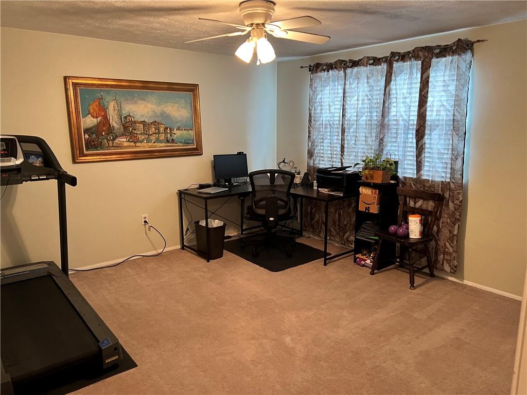 320 Celestial Drive Freedom, PA 15042 - Photo 12 of 25 a view of a workspace with furniture and a window