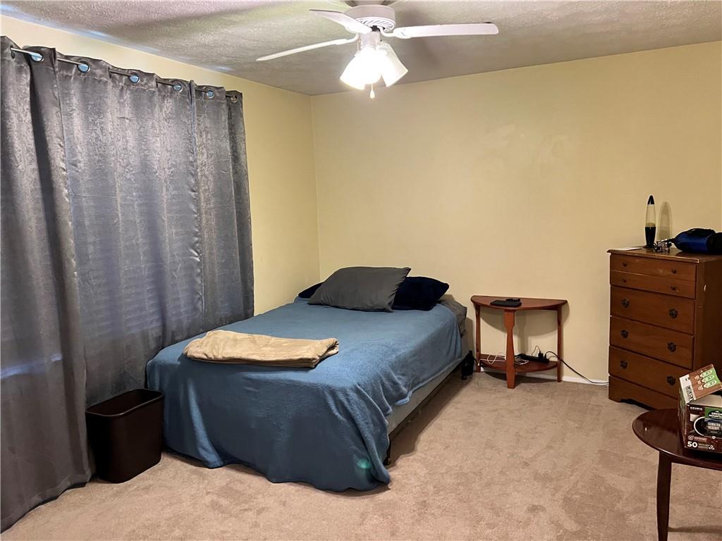 320 Celestial Drive Freedom, PA 15042 - Photo 13 of 25 a bedroom with a bed and a chandelier