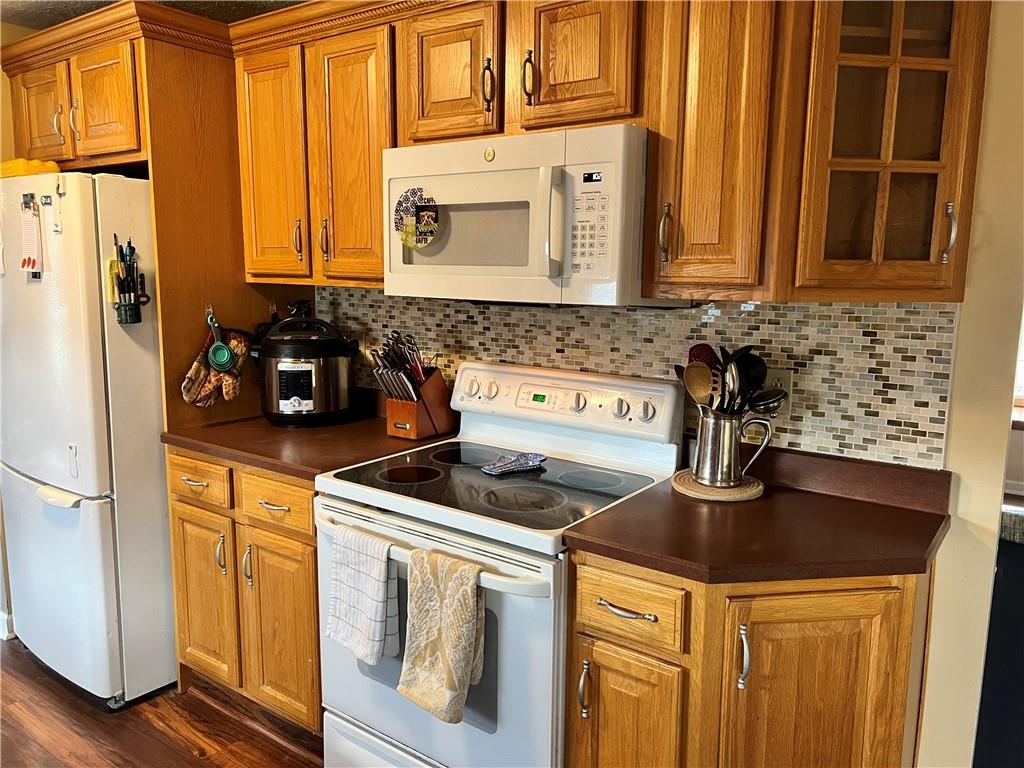320 Celestial Drive Freedom, PA 15042 - Photo 6 of 25 a kitchen with stainless steel appliances granite countertop a sink a stove and cabinets