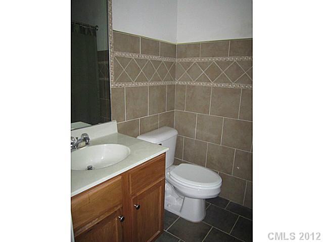 4908 Elizabeth Road Charlotte, NC 28269 - Photo 13 of 16 a bathroom with a sink and a toilet