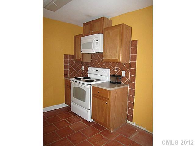 4908 Elizabeth Road Charlotte, NC 28269 - Photo 4 of 16 a view of utility room with washer and dryer