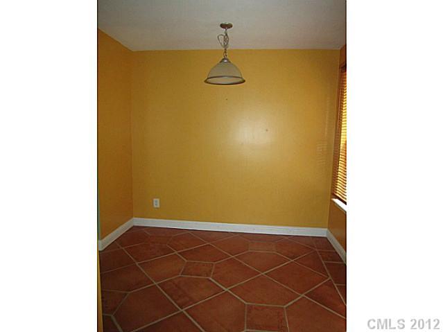 4908 Elizabeth Road Charlotte, NC 28269 - Photo 7 of 16 a view of a room with rack and window