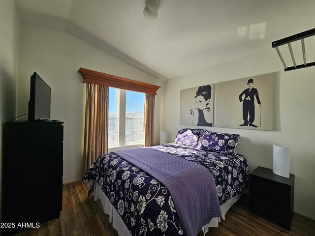 a bedroom with a bed and a closet