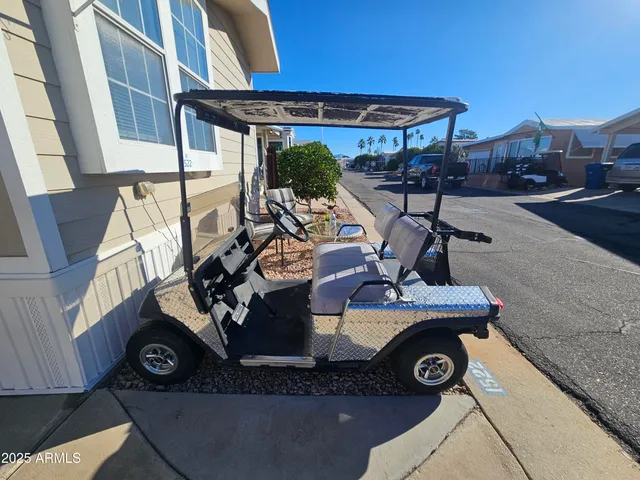 a view of a backyard with sitting area